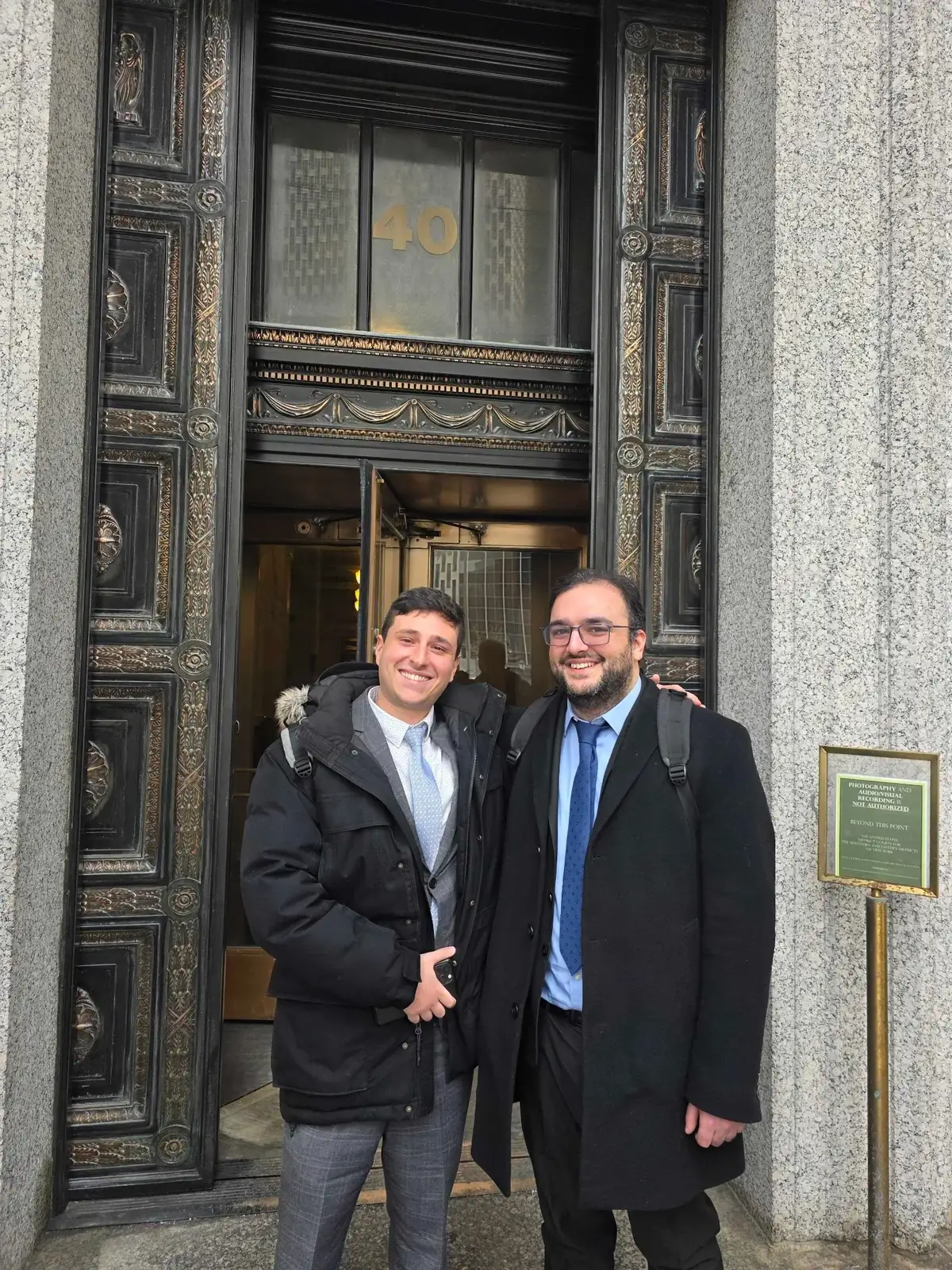 Usher Law Group attorneys outside a federal courthouse